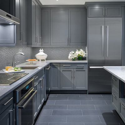 Small trendy galley ceramic tile kitchen photo in Other with an undermount sink, gray cabinets, glass tile backsplash, stainless steel appliances and a peninsula