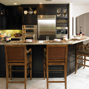 Small Kitchen Remodel Featuring Black Custom Cabinets and Granite Countertop