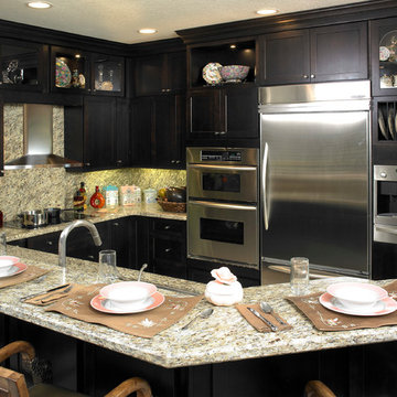 Small Kitchen Remodel Featuring Black Custom Cabinets and Granite Countertop