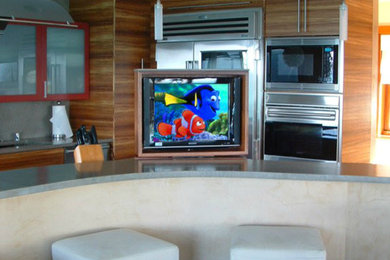 Photo of a medium sized traditional kitchen/diner in Hawaii with a submerged sink, flat-panel cabinets, light wood cabinets, composite countertops and an island.