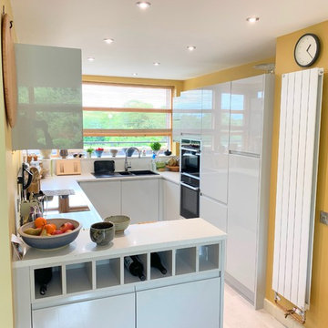 Small, unorganised kitchen transformed to a bright modern space.