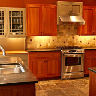 Arts and crafts kitchen in Philadelphia with an undermount sink, shaker cabinets, medium wood cabinets, soapstone benchtops, green splashback, slate splashback, stainless steel appliances, slate floors and green floor.
