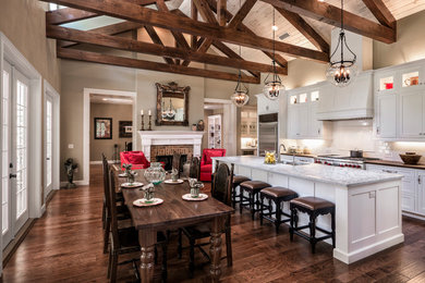 Inspiration for a country galley open plan kitchen in Other with a submerged sink, shaker cabinets, white cabinets, white splashback, metro tiled splashback, stainless steel appliances and an island.