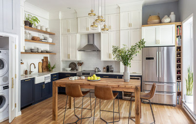 Two-Tone Cabinets and an Open Wood Island in a Sunny Kitchen