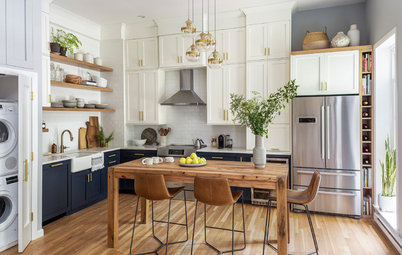Two-Tone Cabinets and an Open Wood Island in a Sunny Kitchen