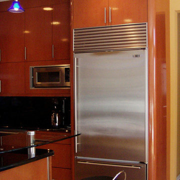 Soft curved corners enclose stainless Sub Zero refrigerator