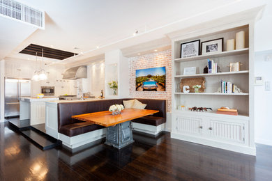 Eat-in kitchen - large eclectic l-shaped dark wood floor eat-in kitchen idea in New York with a farmhouse sink, shaker cabinets, light wood cabinets, marble countertops, white backsplash, subway tile backsplash, stainless steel appliances and an island