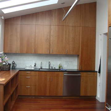 solid cherry cabinets, marble subway tile backsplash, stainless steel appliances