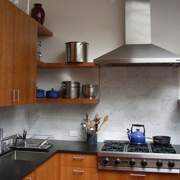solid cherry cabinets, marble subway tile backsplash, stainless steel appliances