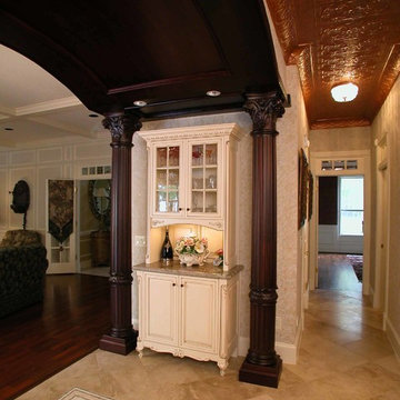 Solid Cherry Columns and Furniture Pieces Welcome Guests into the Kitchne