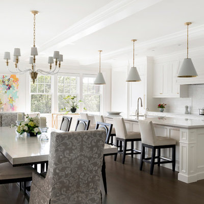Inspiration for a timeless dark wood floor and brown floor open concept kitchen remodel in Minneapolis with recessed-panel cabinets, white cabinets, white backsplash, subway tile backsplash, an island and white countertops