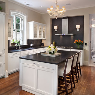 Traditional kitchen photos - Inspiration for a timeless l-shaped kitchen remodel in DC Metro with an undermount sink, recessed-panel cabinets, white cabinets, black backsplash and paneled appliances