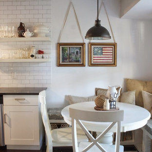 Inspiration for a mid-sized country galley eat-in kitchen in Austin with a double-bowl sink, open cabinets, white cabinets, granite benchtops, white splashback, subway tile splashback, stainless steel appliances, dark hardwood floors and no island.