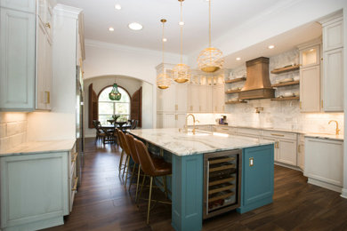 Example of a large transitional galley porcelain tile and brown floor eat-in kitchen design in Orlando with an undermount sink, recessed-panel cabinets, blue cabinets, quartzite countertops, white backsplash, marble backsplash, stainless steel appliances, an island and white countertops