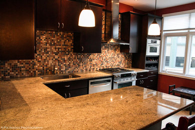 Mid-sized elegant u-shaped porcelain tile eat-in kitchen photo in Chicago with an undermount sink, flat-panel cabinets, dark wood cabinets, granite countertops, multicolored backsplash, porcelain backsplash, stainless steel appliances and an island