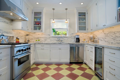 Example of a mid-sized transitional u-shaped enclosed kitchen design in Miami with marble countertops, white backsplash, stainless steel appliances, shaker cabinets, white cabinets and stone slab backsplash