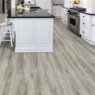 Traditional kitchen in Other with vinyl floors.