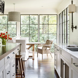 Traditional eat-in kitchen photos - Inspiration for a timeless medium tone wood floor eat-in kitchen remodel in Atlanta with an undermount sink, recessed-panel cabinets, white cabinets and an island