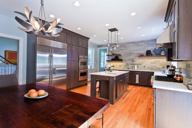 Kitchen - contemporary medium tone wood floor kitchen idea in Philadelphia with recessed-panel cabinets and an island
