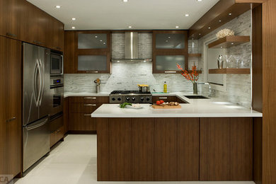 Example of a large minimalist u-shaped concrete floor and gray floor enclosed kitchen design in Toronto with an undermount sink, flat-panel cabinets, dark wood cabinets, solid surface countertops, gray backsplash, marble backsplash, stainless steel appliances, a peninsula and white countertops