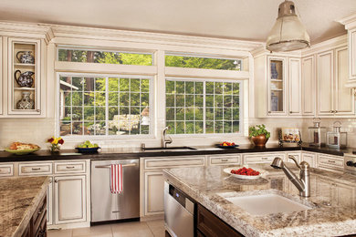 Eat-in kitchen - mid-sized farmhouse u-shaped ceramic tile and beige floor eat-in kitchen idea in Other with an undermount sink, shaker cabinets, beige cabinets, granite countertops, white backsplash, subway tile backsplash, stainless steel appliances and an island