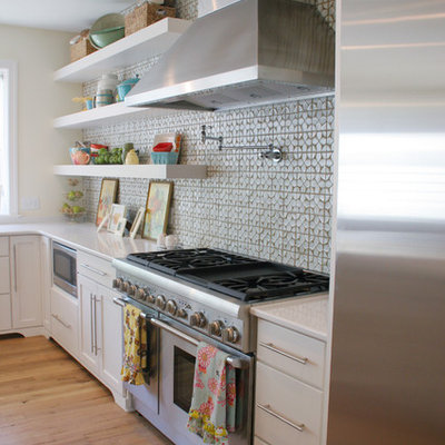 Kitchen - eclectic kitchen idea in Grand Rapids with open cabinets, white cabinets, gray backsplash and stainless steel appliances