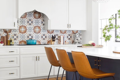 Kitchen - mid-sized eclectic ceramic tile kitchen idea in Dallas with an undermount sink, shaker cabinets, blue cabinets, quartz countertops, multicolored backsplash, ceramic backsplash, stainless steel appliances, an island and white countertops