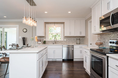 Eat-in kitchen - large transitional l-shaped dark wood floor and brown floor eat-in kitchen idea in Raleigh with an undermount sink, shaker cabinets, white cabinets, quartzite countertops, brown backsplash, porcelain backsplash, an island and stainless steel appliances