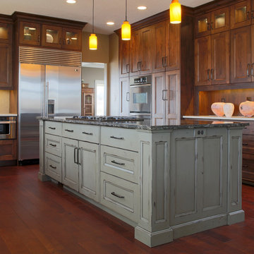Stained Alder perimeter cabinetry with distressed/painted island.
