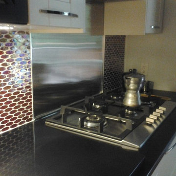 Stainless backsplash for gas range