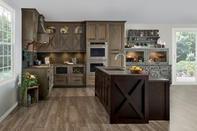Inspiration for a farmhouse medium tone wood floor and brown floor eat-in kitchen remodel in Other with an undermount sink, beaded inset cabinets, dark wood cabinets, stainless steel appliances and an island