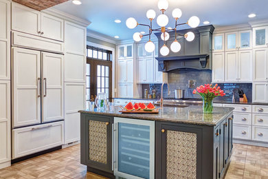 Inspiration for a large timeless brown floor kitchen remodel in Other with recessed-panel cabinets, white cabinets, gray backsplash, paneled appliances and an island