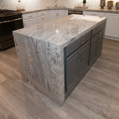 Kitchen - transitional vinyl floor kitchen idea in Other with an undermount sink, raised-panel cabinets, granite countertops, gray backsplash, mosaic tile backsplash and an island