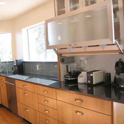 Example of a large transitional dark wood floor eat-in kitchen design in Albuquerque with an undermount sink, flat-panel cabinets, medium tone wood cabinets, quartz countertops, green backsplash, glass tile backsplash, stainless steel appliances and no island