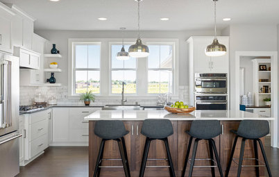 4 Kitchens With White Cabinets and a Wood Island
