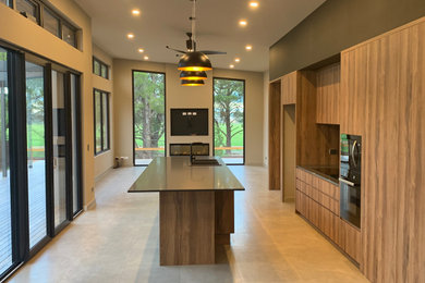 Example of a mid-sized minimalist galley open concept kitchen design in Adelaide with an island