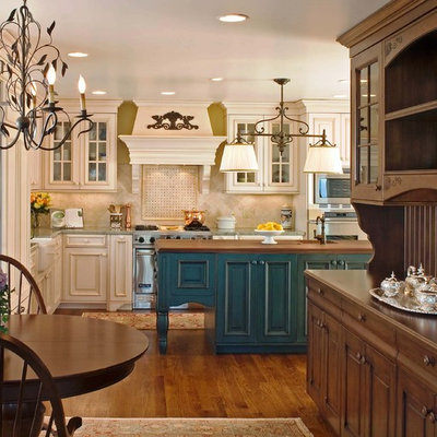 Kitchen - traditional kitchen idea in San Diego with wood countertops