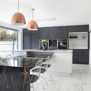Stunning contemporary open plan kitchen with Sensa natural stone dining area