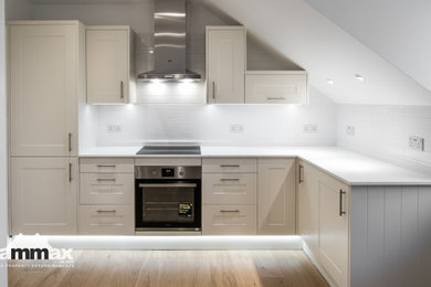 This is an example of an expansive contemporary l-shaped kitchen/diner in Hertfordshire.