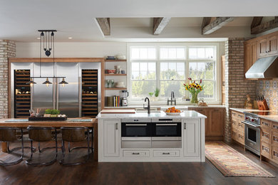 Large trendy medium tone wood floor eat-in kitchen photo in Los Angeles with stainless steel appliances and an island