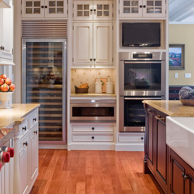 Inspiration for a timeless kitchen remodel in Boston with beaded inset cabinets, stainless steel appliances, a farmhouse sink and white cabinets