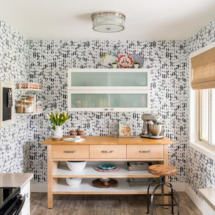This is an example of a small country galley separate kitchen in Denver with flat-panel cabinets, white cabinets, light hardwood floors and beige floor.