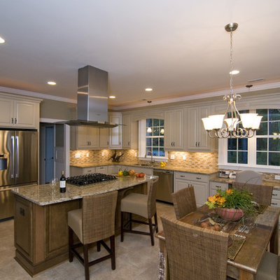 Elegant eat-in kitchen photo in Raleigh with stainless steel appliances and beige backsplash