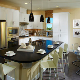 Mid-sized transitional eat-in kitchen inspiration - Inspiration for a mid-sized transitional l-shaped dark wood floor eat-in kitchen remodel in San Francisco with an undermount sink, shaker cabinets, white cabinets, granite countertops, mosaic tile backsplash, stainless steel appliances and an island