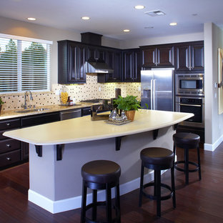 Large transitional open concept kitchen designs - Large transitional l-shaped dark wood floor open concept kitchen photo in San Francisco with an undermount sink, shaker cabinets, dark wood cabinets, granite countertops, mosaic tile backsplash, stainless steel appliances and an island