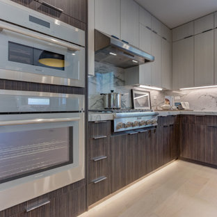 Open concept kitchen photos - L-shaped open concept kitchen photo in San Francisco with shaker cabinets, stainless steel appliances, an island and an undermount sink