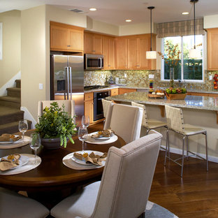 Large transitional eat-in kitchen remodeling - Large transitional l-shaped medium tone wood floor eat-in kitchen photo in San Francisco with an undermount sink, shaker cabinets, medium tone wood cabinets, granite countertops, multicolored backsplash, mosaic tile backsplash, stainless steel appliances and an island