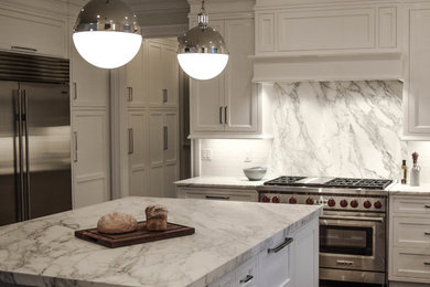 Example of a transitional dark wood floor eat-in kitchen design in Newark with an island, flat-panel cabinets, white cabinets, marble countertops, white backsplash, stone slab backsplash and stainless steel appliances
