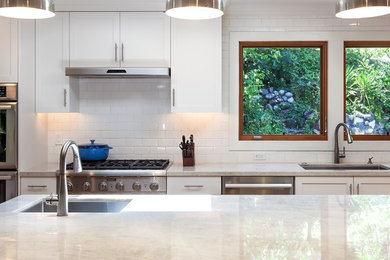 Example of an arts and crafts kitchen design in San Francisco with quartzite countertops and an island