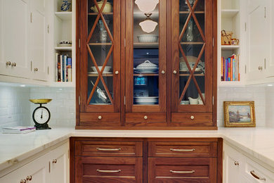 Inspiration for a large traditional u-shaped kitchen pantry in Toronto with shaker cabinets, medium wood cabinets, marble worktops and medium hardwood flooring.